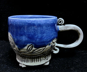 Mug, carved, footed