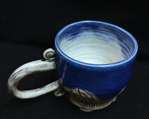 Mug, carved, footed